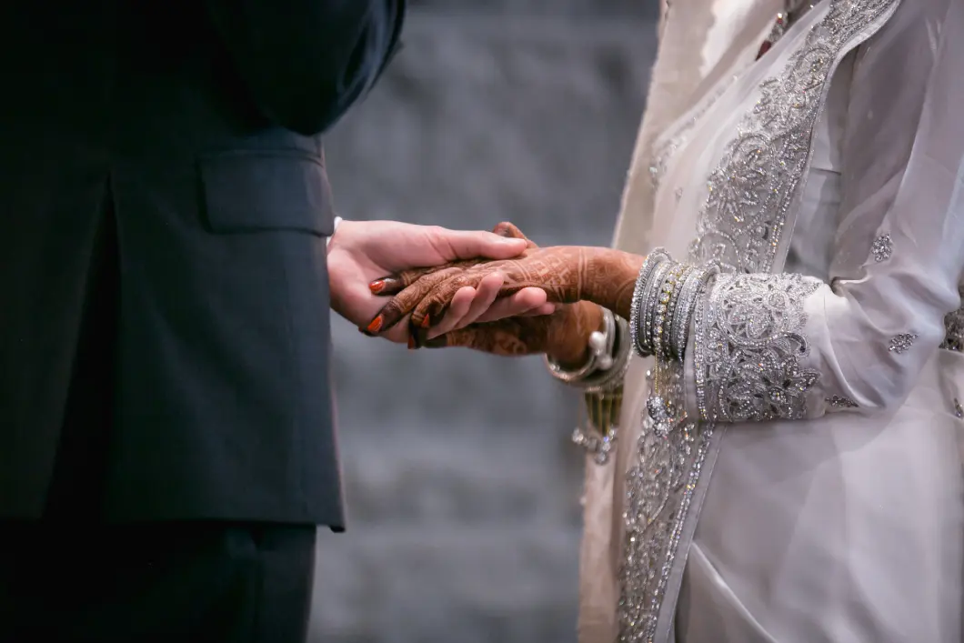 White saree wedding dress with bangles and hand